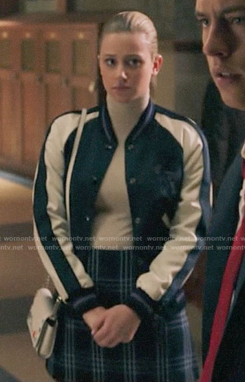 Betty’s dinosaur bomber jacket and plaid skirt on Riverdale