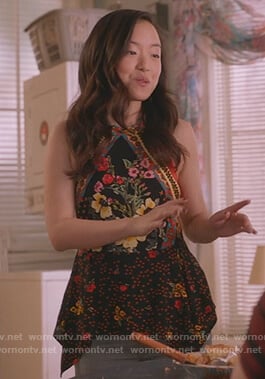 Janet’s black floral asymmetric top on Kims Convenience