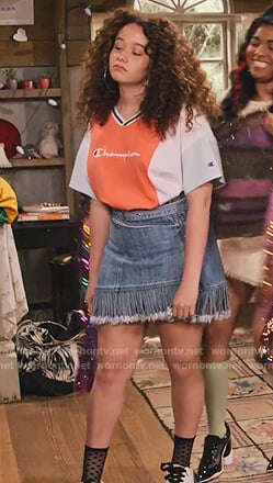 Jade’s Champion colorblock tee and fringe denim skirt on Family Reunion