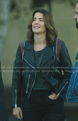 Dex’s black moto jacket with red panels on Stumptown