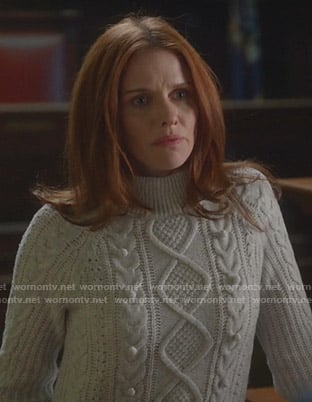 Elizabeth’s white cable knit sweater on Bull