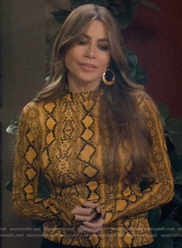 Gloria’s yellow snake print top on Modern Family