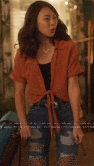 Kamilla’s orange tie front top on The Flash