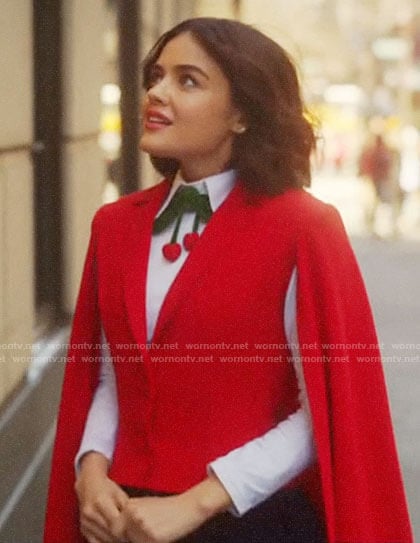Katy’s white top with velvet cherries and red cape on Katy Keene