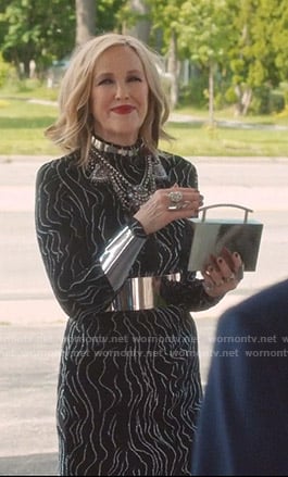 Moira’s black embellished stripe dress on Schitts Creek