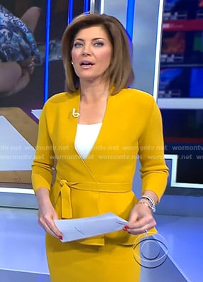 Norah’s yellow wrap peplum jacket and skirt on CBS Evening News