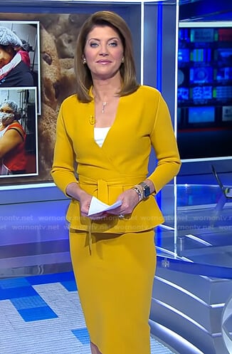 Norah’s yellow wrap peplum jacket and skirt on CBS Evening News