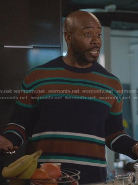 Oliver’s navy and brown striped sweater on The Bold Type