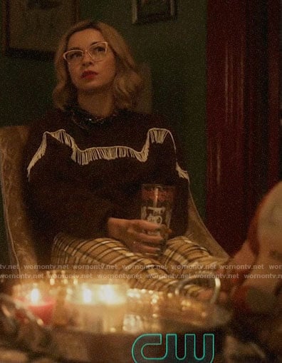 Pepper’s brown fringed sweater and plaid pants on Katy Keene