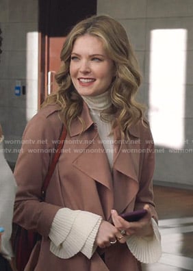 Sutton’s white ribbed ruffle cuff sweater on The Bold Type