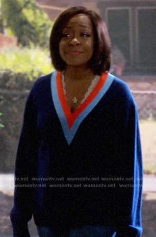 Tina’s blue striped trim v-neck sweater on The Neighborhood