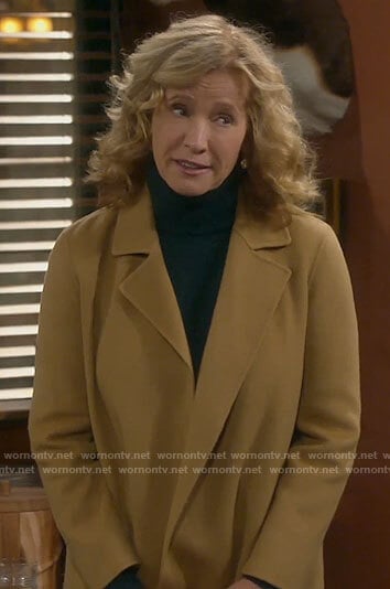 Vanessa’s short camel coat on Last Man Standing