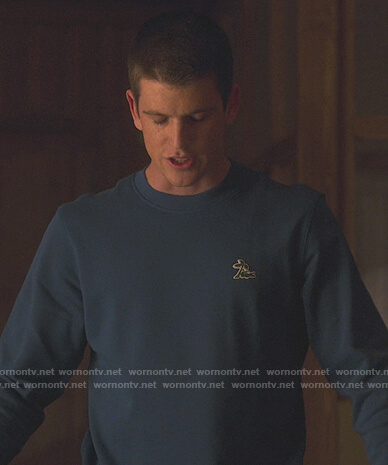 Guzman’s teal Lacoste sweatshirt on Elite
