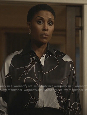 Lynn’s navy abstract print blouse on Black Lightning
