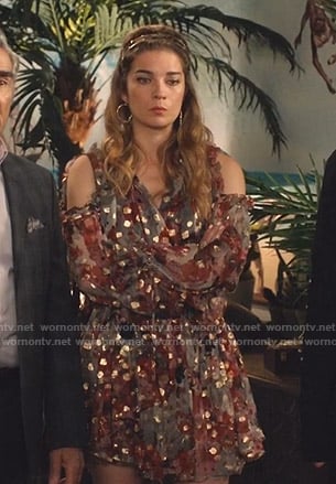 Alexis’ metallic cold-shoulder chiffon dress on Schitts Creek
