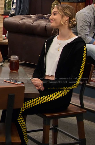 Brooke’s black and yellow checkerboard track suit on The Expanding Universe of Ashley Garcia