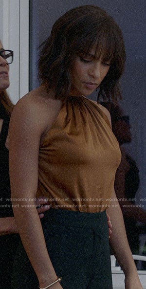 Edie’s gold halter neck top on Almost Family