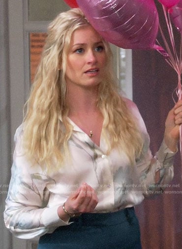 Gemma’s white floral button down blouse on The Neighborhood