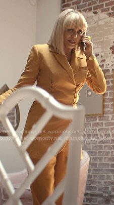 Giselle’s orange button detail jacket and pants on Empire
