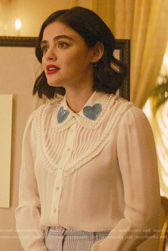Katy’s white blouse with blue sequin heart collar on Katy Keene