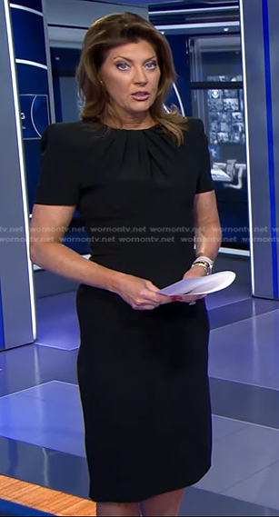 Norah’s black pleated neck sheath dress on CBS Evening News