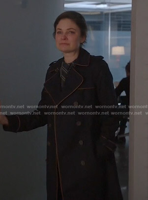 Taylor’s navy trench coat with piping trim on Bull