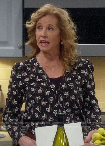 Vanessa’s black floral v-neck blouse on Last Man Standing