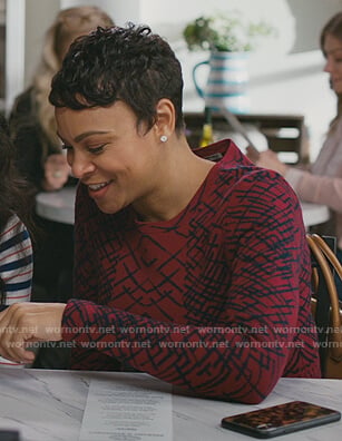 Angela’s red printed peplum sweater on American Housewife