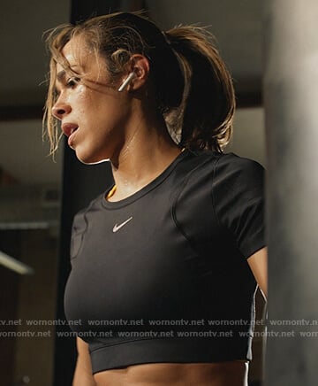 Emily’s black cropped Nike top on All Rise