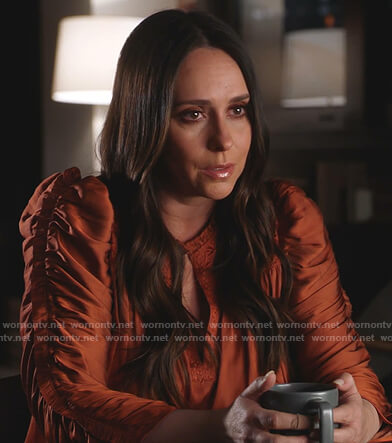 Maddie’s orange ruched sleeve satin blouse on 9-1-1