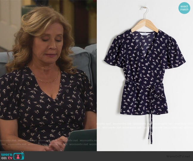 & Other Stories Floral Wrap Blouse worn by Vanessa Baxter (Nancy Travis) on Last Man Standing