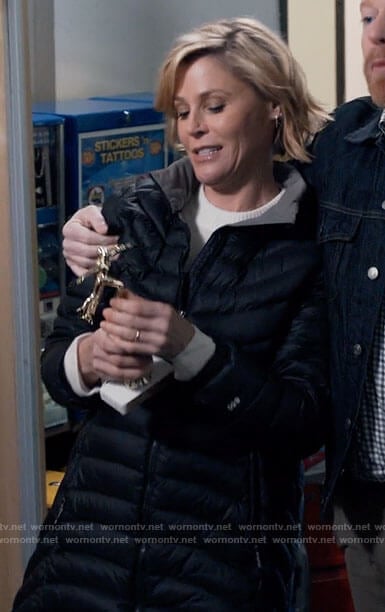Claire’s black puffer coat on Modern Family