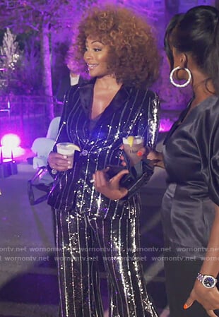 Cynthia’s black metallic stripe blazer on The Real Housewives of Atlanta