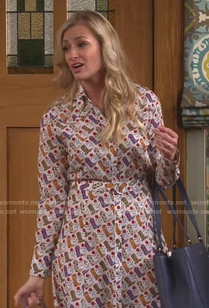 Gemma’s white cowboy boot print shirtdress on The Neighborhood