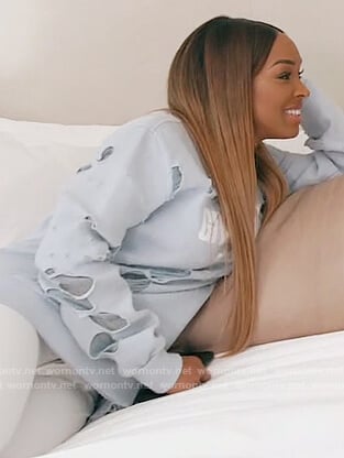 Malika’s blue distressed Givenchy sweatshirt on Keeping Up with the Kardashians