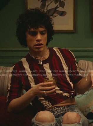 Jorge’s burgundy striped knit top on Katy Keene