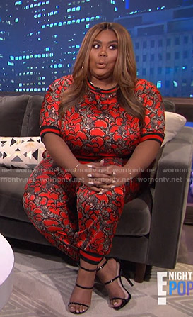 Nina’s red print stripe top and pants on E! News Nightly Pop