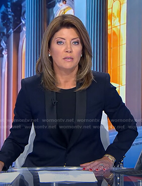 Nora’s navy contrast shawl collar blazer on CBS Evening News