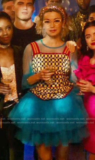 Pepper’s blue tulle dress and checked knit top on Katy Keene