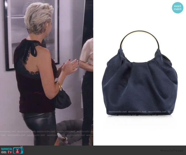 The Row Micro Satin Double Circle Bag worn by Dorinda Medley on The Real Housewives of New York City