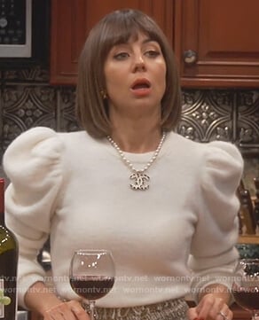 Elizabeth’s white puff shoulder sweater on Broke