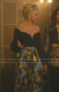 Gloria’s embellished off-shoulder top and floral skirt on Katy Keene