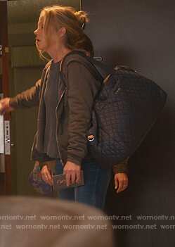 Jen’s blue quilted travel bag on Dead to Me