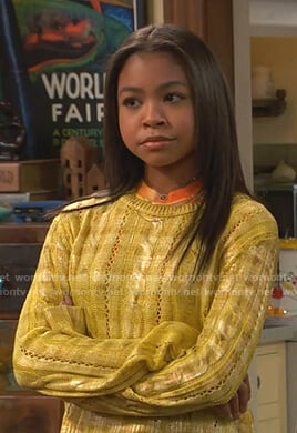 Nia’s metallic yellow cable knit sweater on Ravens Home