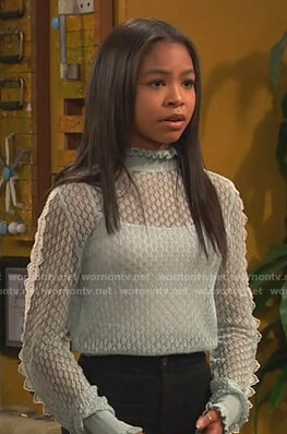 Nia’s aqua blue sheer sweater on Ravens Home