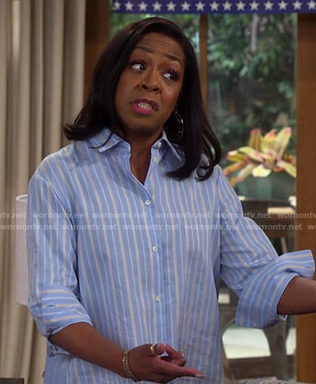 Tina’s blue stripe pleated back shirt on The Neighborhood