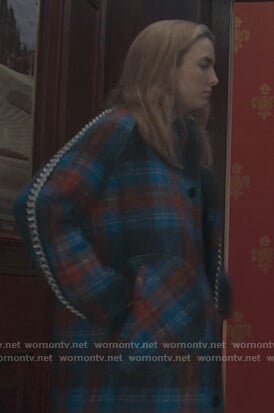 Villanelle’s blue plaid coat and chain trim skirt on Killing Eve