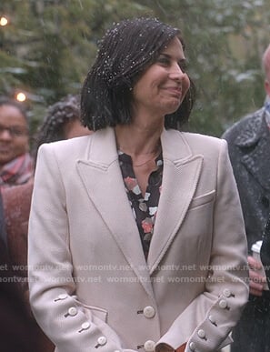 Cassie’s ivory button-sleeve coat on Good Witch