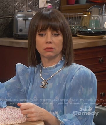 Elizabeth’s blue floral pleated blouse on Broke