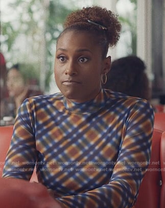 Issa’s orange plaid mock neck top on Insecure